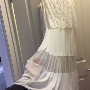 Flowing white pleated lace dress